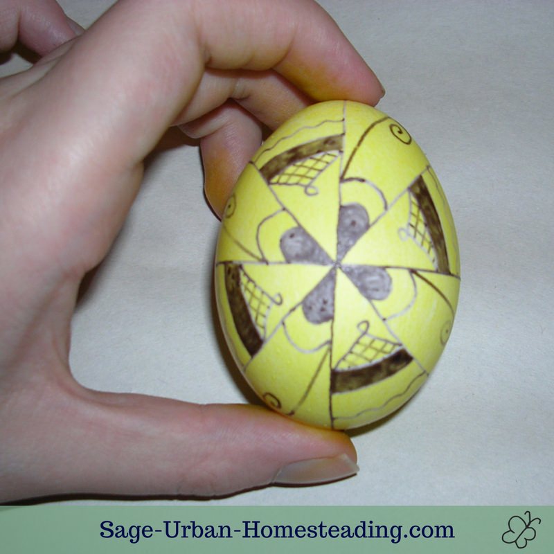 yellow egg with wax decoration