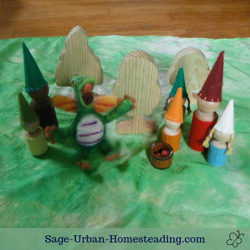 Waldorf Essentials K2 October week 2 story scene, gnomes harvesting apples with a dragon